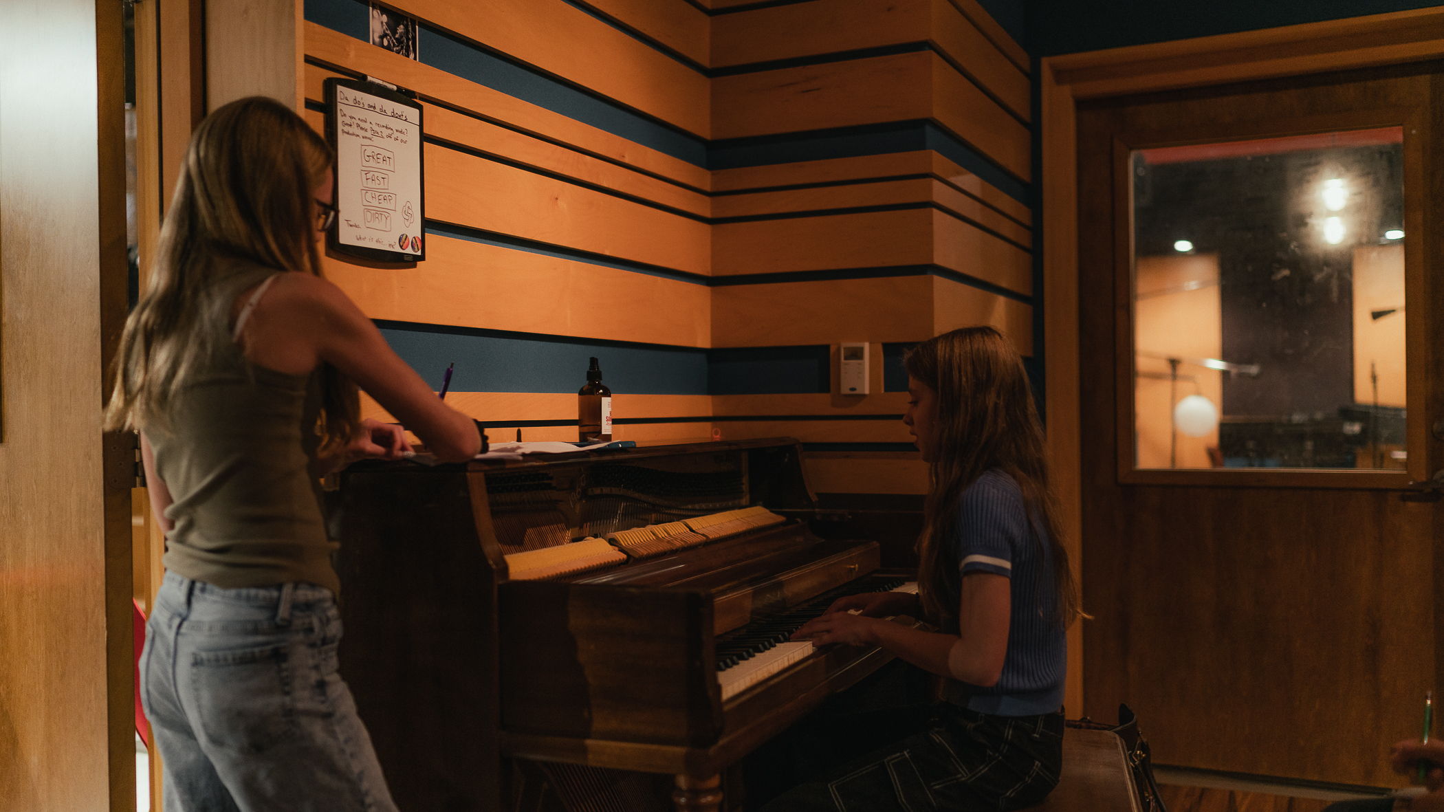A student and teacher work through a piece of music together